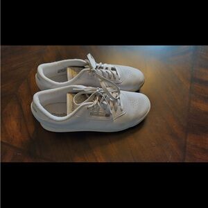 Women’s white Reebok.